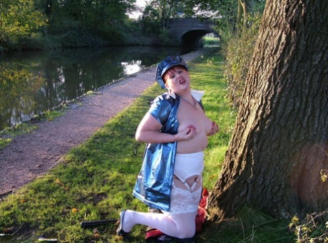 During a canal path, the overweight redhead Valgasmic Exposed exposes herself as she walks along.