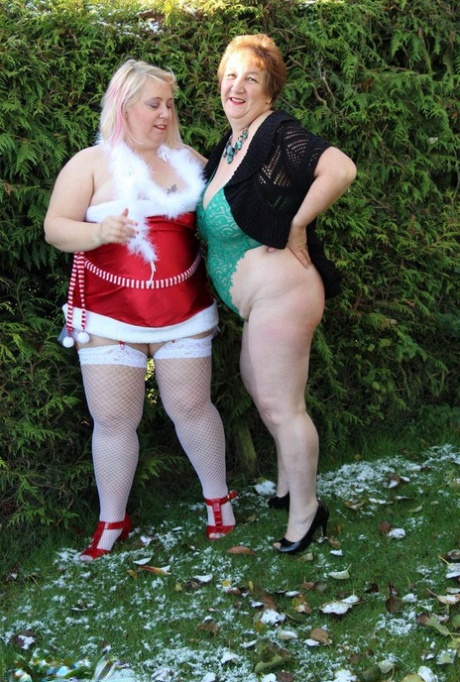 Fat granny Kinky Carol and her BBW girlfriend exposed their breasts in front of the couple in a yard.