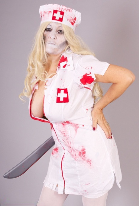 Old Blonde Amateur Savana Removes A Nurse Uniform During A Cosplay Scene