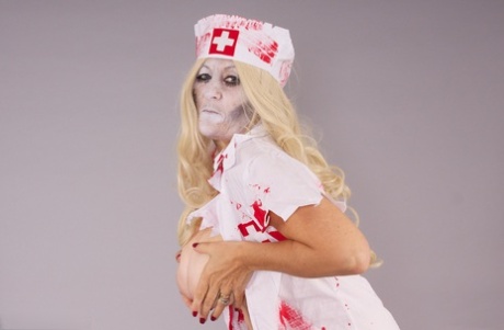 As she performs in a cosplay scene, Savana the blonde amateur takes off her nursing uniform.