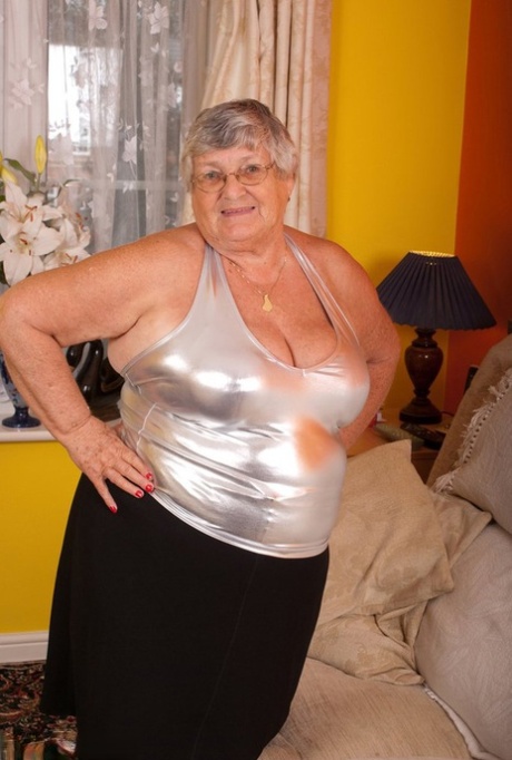 Using the vibrator in her old, fat pantyhose without a crotch, Grandma Libby masturbates.