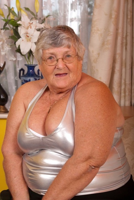 Grandma Libby, who is old and fat, masturbates while wearing crotchless pantyhose and using a vibrator.