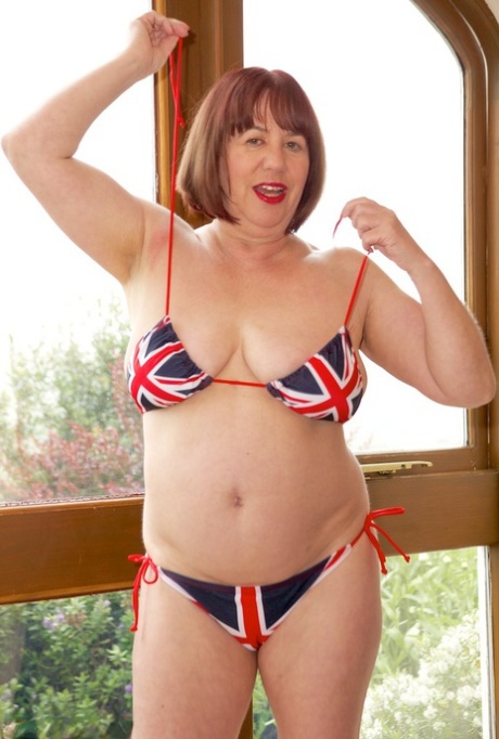 Older UK Redhead Speedy Bee Doffs A Union Jack Bikini To Get Naked