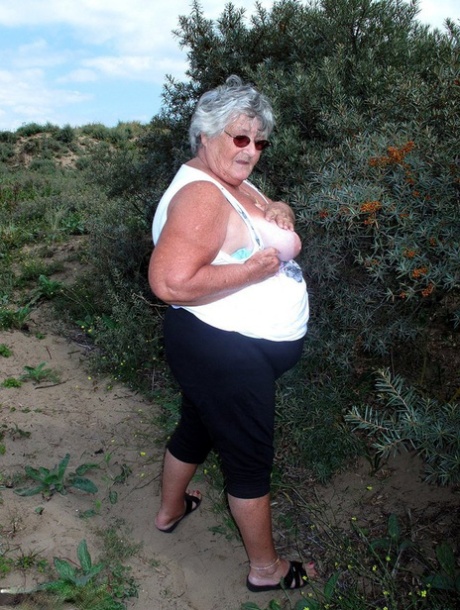 While exploring nature, Fat British Nana Libby goes completely naked.