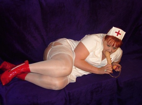 During dildo play, Valgasmic Exposed, a mature redheaded nurse, exposes herself.