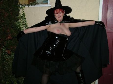 Older Redhead Valgasmic Exposed Displays Her Pussy In Cosplay Wear By The Shed