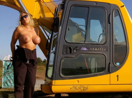 Blonde amateur Nude Chrissy gets naked in shades afore heavy equipment