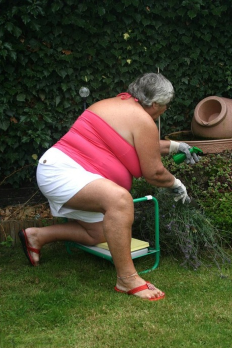 Big boobs: Grandma Libby, the fat mama, shows off her huge ass before enjoying herself by licking her nipple in her yard.