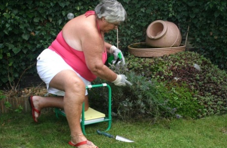 Fat nan Grandma Libby bares her huge ass before licking a nipple in her yard
