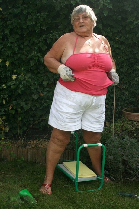 In her yard, Grandma Libby shows off her large ass before proudly kissing her penis.