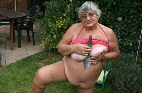 Libby, the obese grandma, displays her large buttocks and proceeds to massage it in her yard.