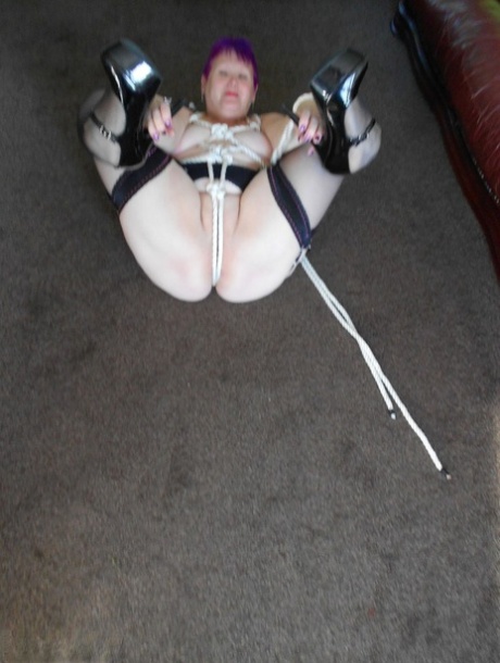 An older female experiences Valgasmic Exposed while sporting short hair and being tied up with rope.
