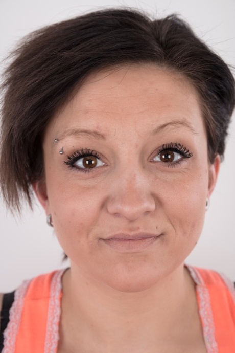 Misa, the amateur tattoo artist, displays her trimmed vagina after completely disrobing it.