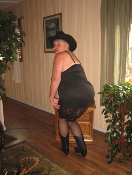 Girdle Goddess Fat Oma appears unclothed in a cowgirl cap and boots.