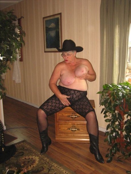 Girdle Goddess Fat Oma exposes herself wearing revealing boots and a cowgirl cap.