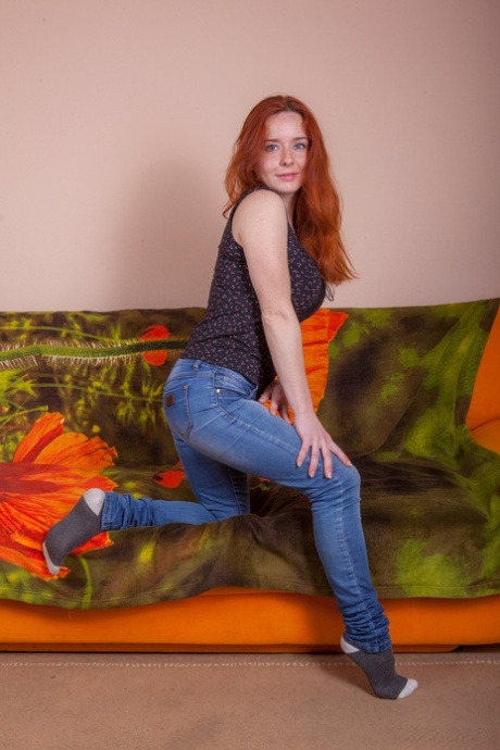 Natural Redhead Sara Nikol Uncorks Her Big Naturals As She Strips Naked