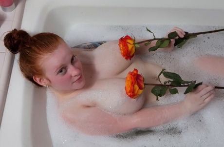 Pale Redhead Kaycee Barnes Displays Her Large Boobs And Butt During A Bath