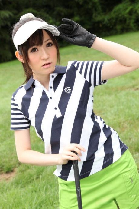 At the golf links, an attractive Japanese sports enthusiast is dressed in sexy panty attire.