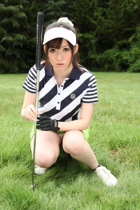 The golf course displays a stunning Japanese sports woman wearing a suggestive panty on the green.