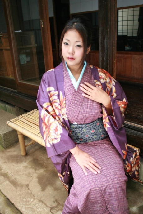 In a statement fashion, the Japanese woman wears her usual no panty upkirt while wearing her kimono on the patio.