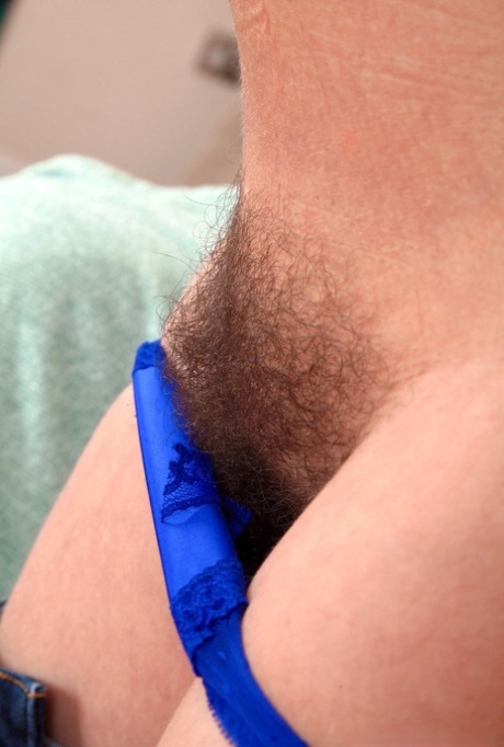 An older fellow called Alexis May bares her big natural features before showing off her full bush.