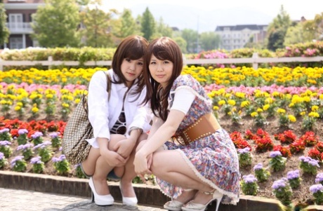 The naked legs of Japanese lesbians Rimu Endo and Ueno Misaki are displayed while taking a walk.