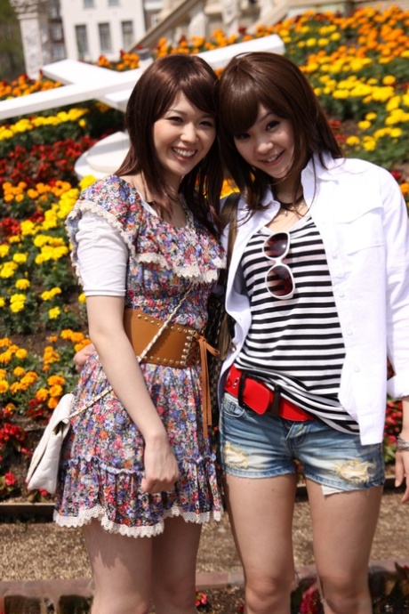 Rimu Endo and Ueno Misaki, both Japanese lesbians, exhibit their legs without clothing while taking a walk.