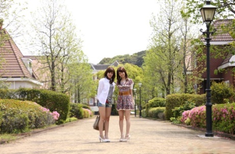 During their daily walks, Japanese lesbians Rimu Endo and Ueno Misaki exhibit their legs without clothing.