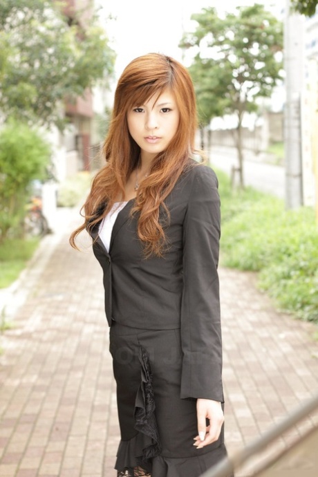 Seductively dressed outoors are posed by the beautiful Asian girl Rina Kikukawa.