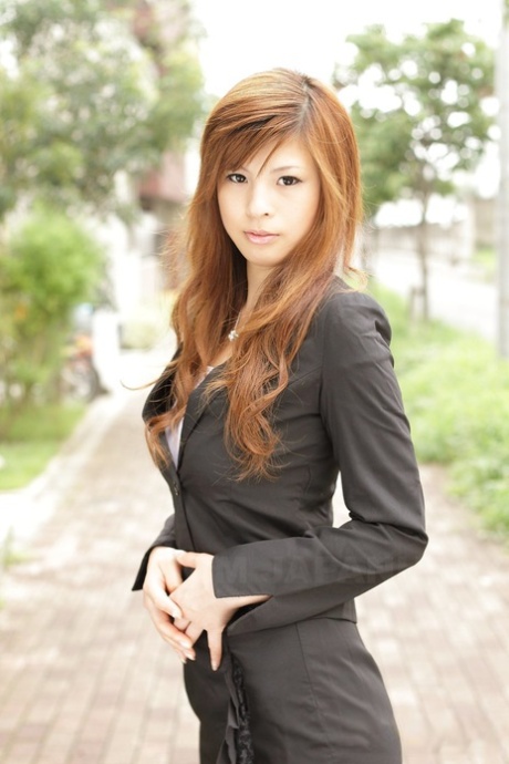 Unconventional: The beautiful Asian girl Rina Kikukawa poses in a seductive ensemble, fully clothed.