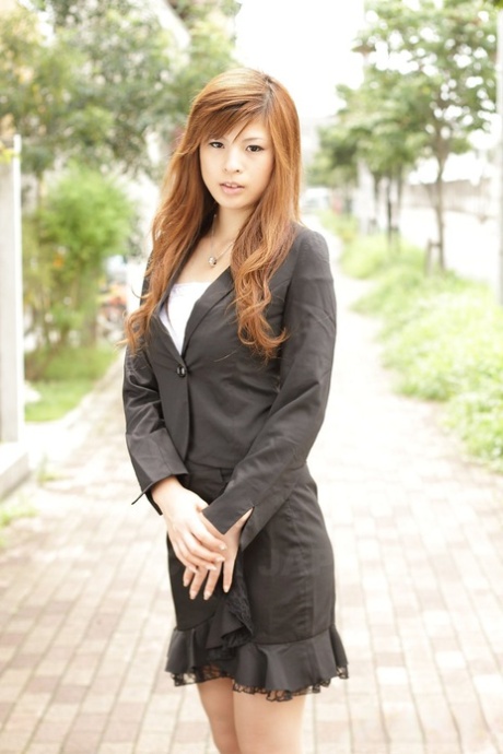 Fully clothed and seductively dressed is the Asian beauty Rina Kikukawa.