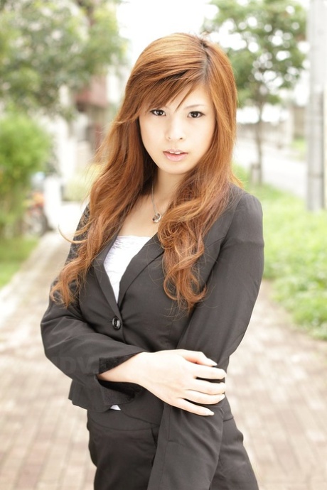 Stunning Asian girl Rina Kikukawa poses seductively fully clothed outoors