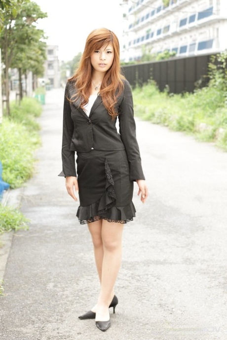 Stunning Asian girl Rina Kikukawa poses seductively fully clothed outoors