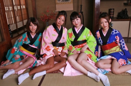 Sexy Japanese young women remove their kimonos for group groping.