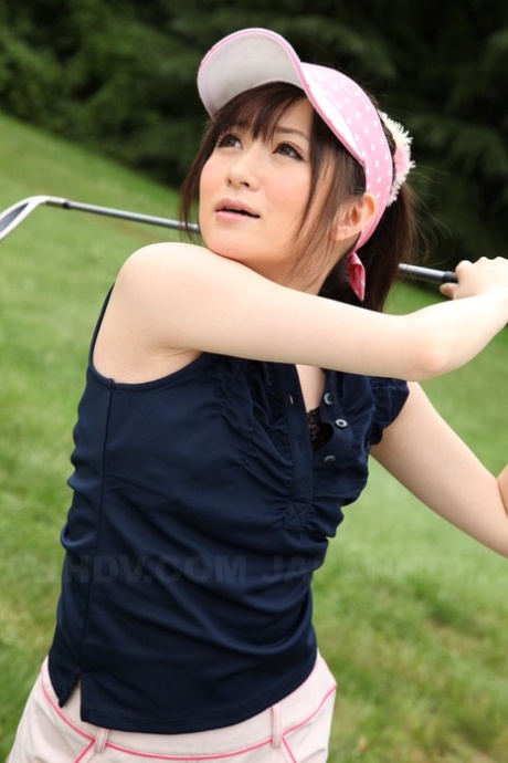 Golf swing nude: Sweet sports girl Michiru Tsukino practises her technique on links.