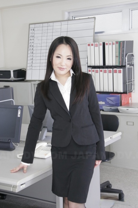 Japanese secretary Ai Mizushima displays business attire while wearing clothing that is not nude during work hours.