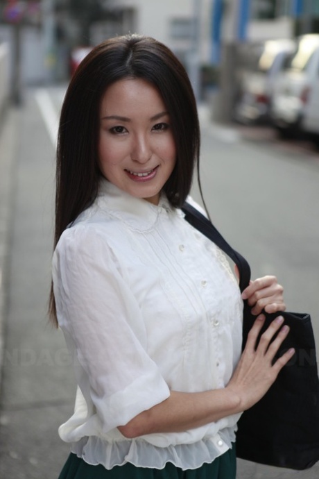 To showcase her stunning looks, Anna Sakura, a Japanese student, stops in the street.