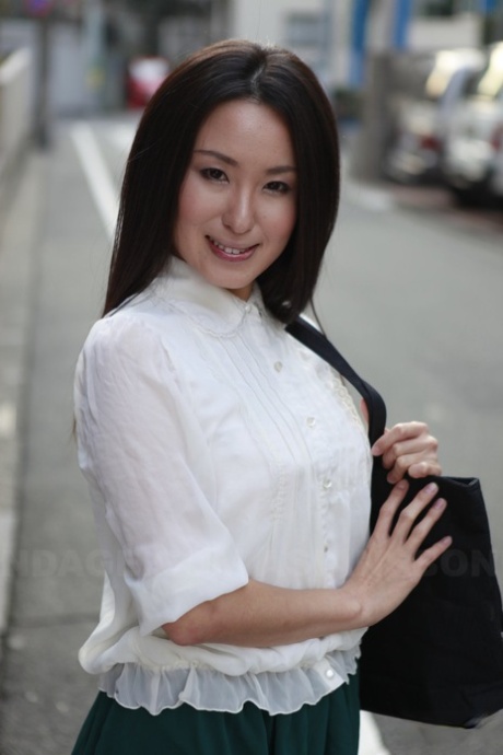 Japanese student Anna Sakura takes a moment to exhibit her stunning looks on the street.