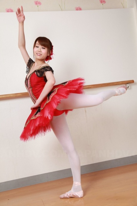 A bustling Japanese ballerina named Ririka Suzuki performs topless during practice.