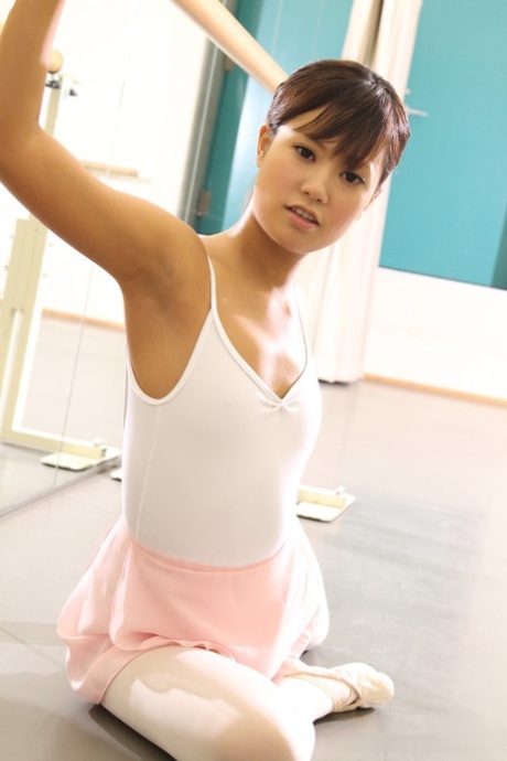 Japanese ballerina Ruri Kinoshita expose her young fantasies wearing tight and tutu while stretching them.