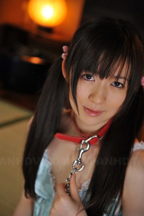 In Japan, Ai Uehara sports a collar and leash that she wears her hair in full extensions.