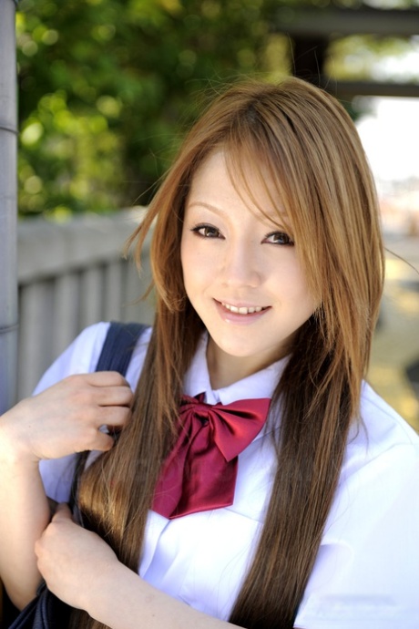 Innocent Japanese schoolgirl Ria Sakurai flashes sexy white panties in public - PornHugo.net