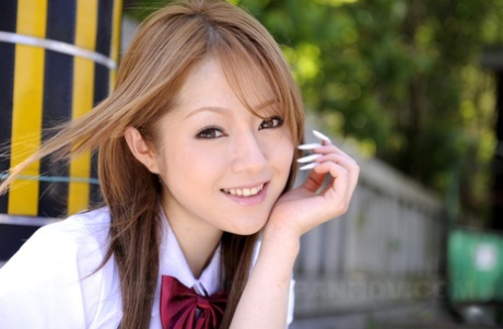 Innocent Japanese schoolgirl Ria Sakurai flashes sexy white panties in public - PornHugo.net