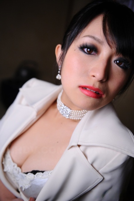Shiny: Japanese model Nana Kunimi shows off her lace bra with red lips.