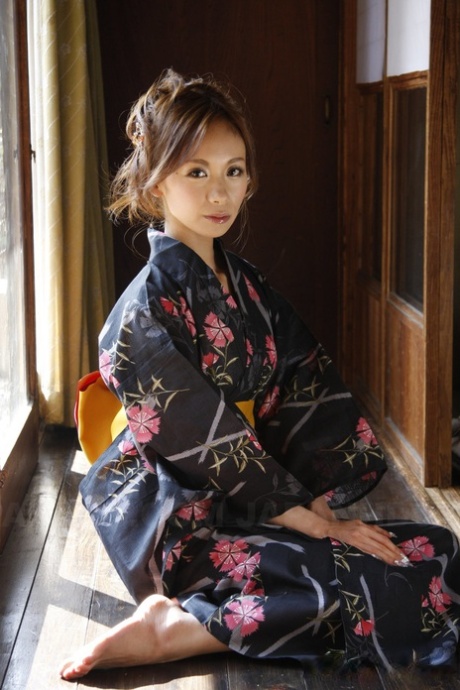 Japanese model Shuri Maihama undresses in a kimono while removing upskirt panties.