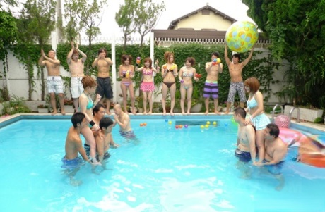 Swimming pool volleyball: Japanese women lose their bikinis in a wrestling match at the same swimming pool.