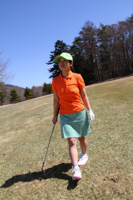 Nana Kunimi, a Japanese golfer, shows off his no-frills outfit while lining up a putt.