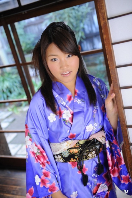 The shoulders of the Japanese female Nene Nagasawa are bared in a classic Kimono robe.