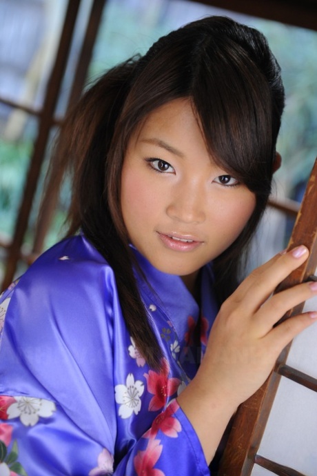 Japanese woman Nene Nagasawa wear her shoulders in a traditional Kimono dress.