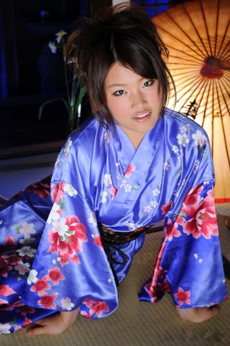 Wearing a traditional Kimono gown, Japanese female Nene Nagasawa exposes her shoulders.